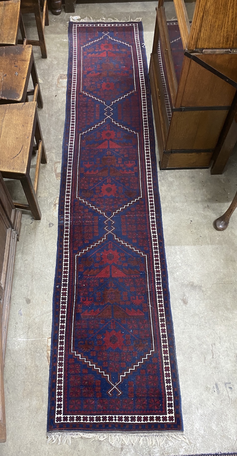 A Turkish blue ground runner, 290 x 59cm